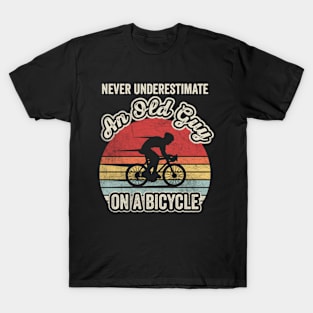 Never Underestimate An Old Guy On A Bicycle Funny Cycling Vintage Biker Cyclist Dad Gift Biker Gift Retro Bike T-Shirt